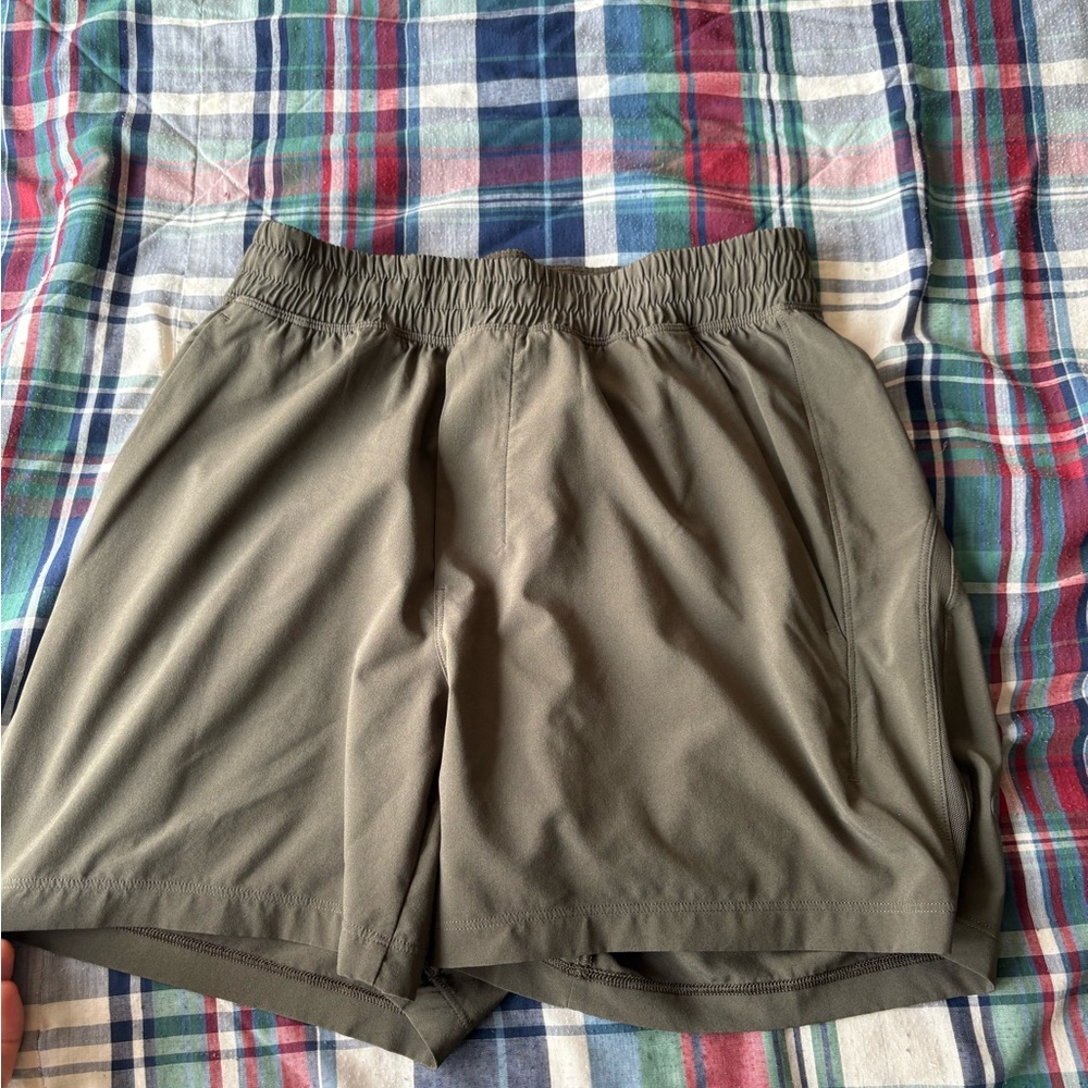 Lululemon olive gym shorts. Inseam is 5 inches barely used and good condition XS